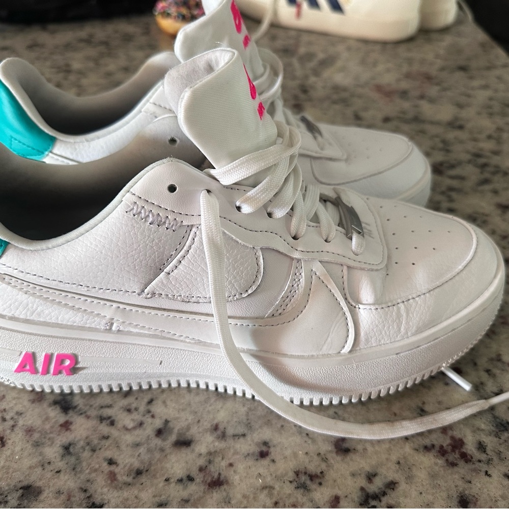 Women’s Nike AF1(Air Force). Size 9.  White with pink and teal details.